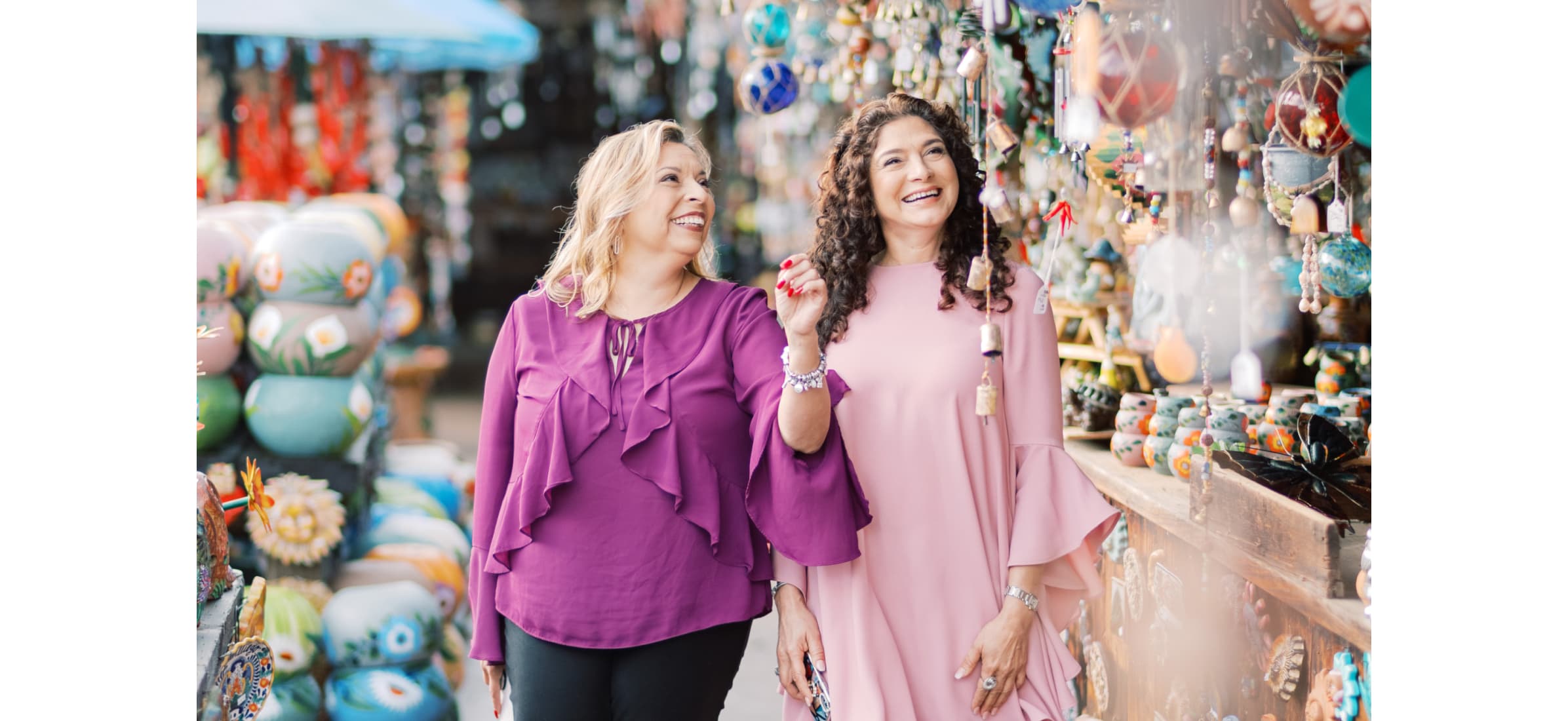 Nury walks with a client through the outdoor markets of San Diego.